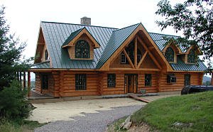 sprwaling log home with dramatic roof design
